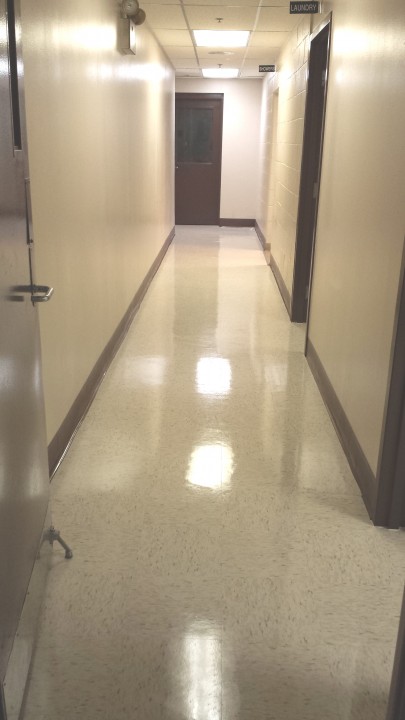 BlackHawk Janitorial Services LLC janitor in Smyrna, GA mopping floor.